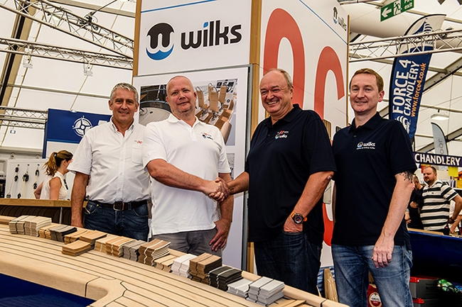 Acquisition success: Flexiteek owners with Wilks owners.